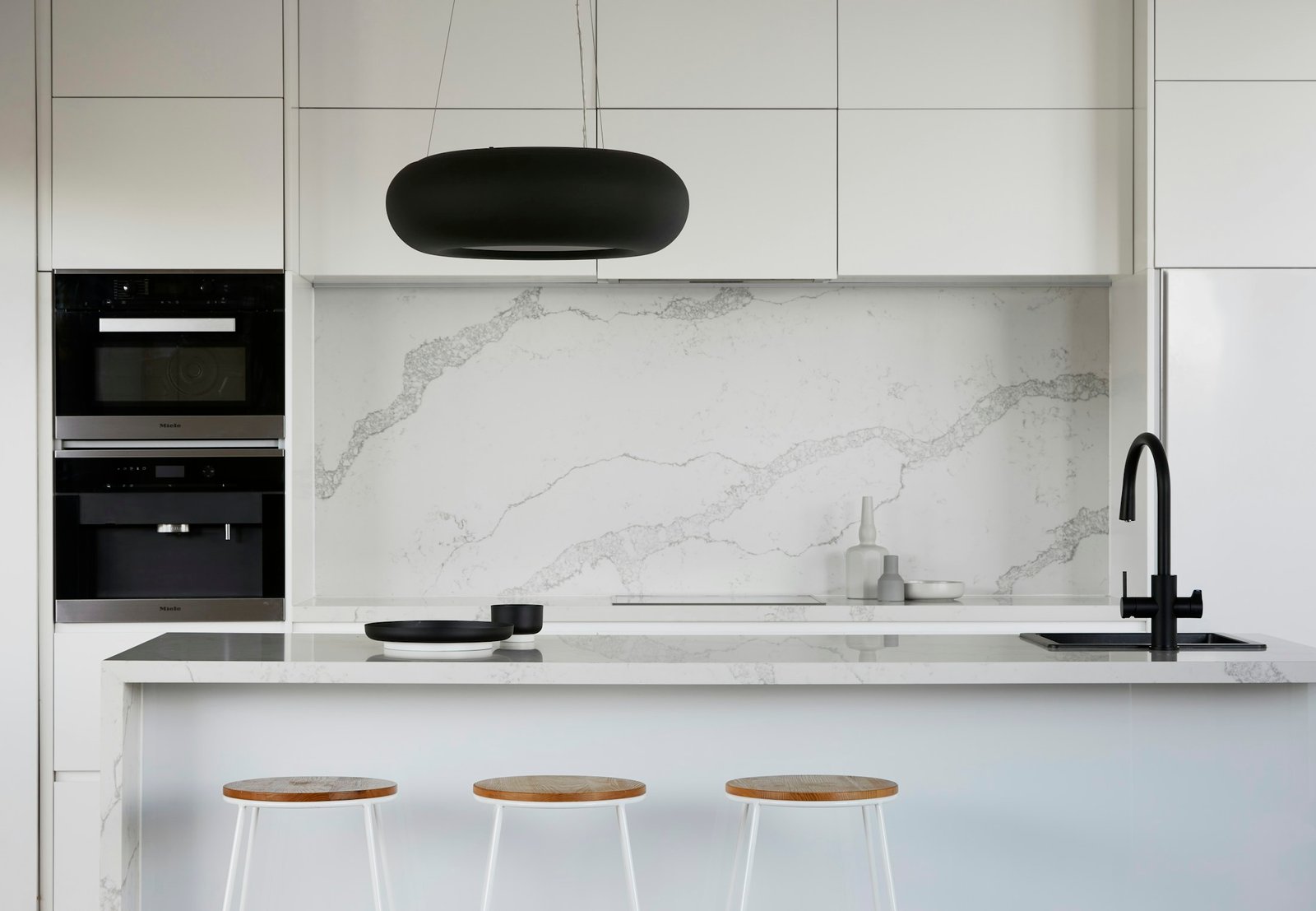 Marble kitchen with black designer faucet